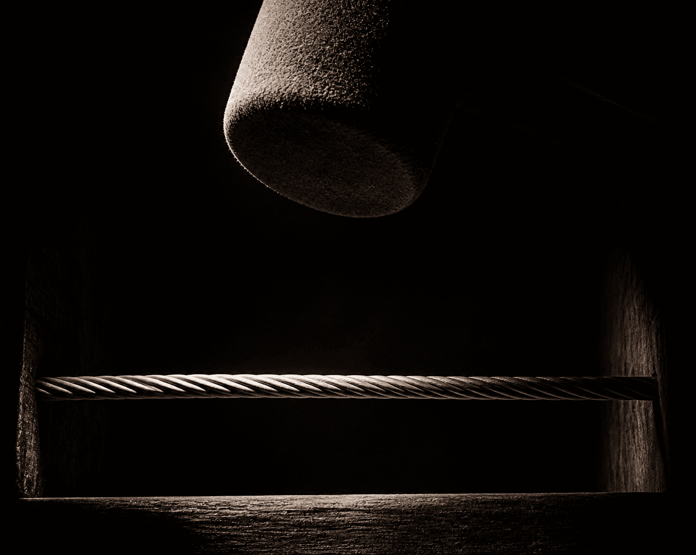 A film noir still rendered as an invented tableau: a single coil of taut wire, impossibly enlarged, strung across a black wooden cavity, lit by one hard raki...